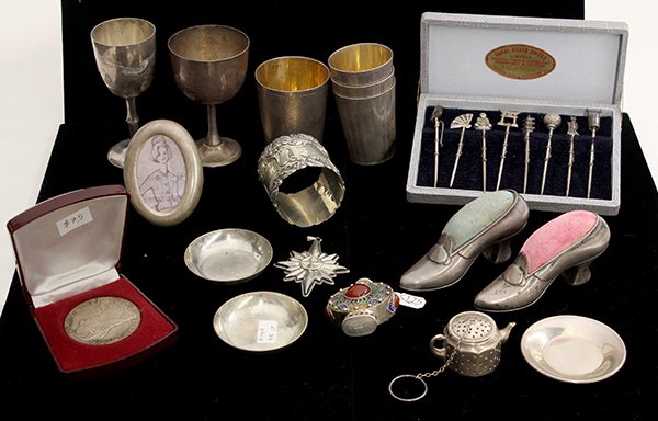 Silver collectibles consisting: (lot of 17) Silver collectibles consisting of a pair Gorham sterling shoe form pin cushions; Amcraft sterling boxed tea strainer and saucer; Reed & Barton sterling 1978 Christmas Star; Mexican sterlin