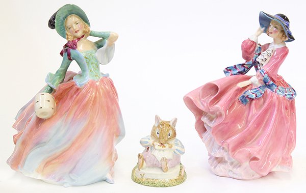 Royal Doulton porcelain figurines: (lot of 3) Royal Doulton porcelain figurines, consisting of, 'Autumn Breezes' depicting a maiden with a fur muff and celadon green bonnet, 7.5"h; 'Top of the Hill' depicting a beauty in a pink gown an