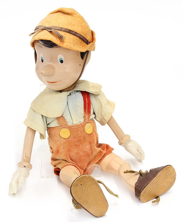 Vintage Pinocchio composite figure: Vintage Pinocchio composite figure, the Disney character having moveable arms and legs, and dressed in traditional attire, 13"h