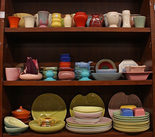 (lot of 82) Collection of California art pottery: (lot of 82) Collection of California art pottery including table articles by Russel Wright, William Maker, (4) candle holders by Shearwater executed in mottled blue, a Jugtown lidded tureen and plates