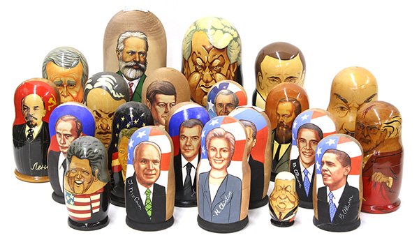 Group of Russian style nesting dolls: (lot of 21) Group of Russian style nesting dolls, each depicting a world leader, many American, including Bill Clinton, Barak Obama, Hillary Clinton, John F. Kennedy, etc., tallest: 10.5"h