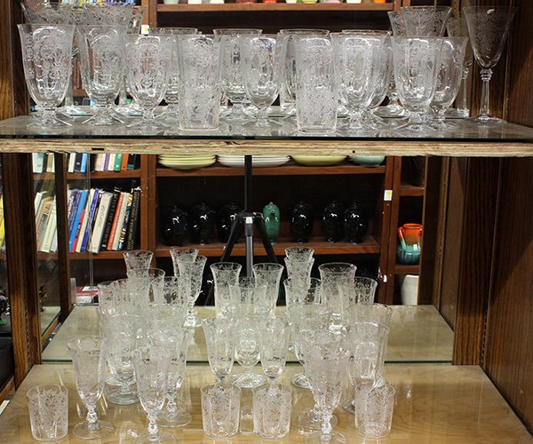 Crystal stemware group: Crystal stemware group, each cup having etched floral decoration, consisting of (6) cordials, (7) champagnes, (4) red wines, (6) water glasses, and (15) smaller water glasses, tallest: 7.5"h