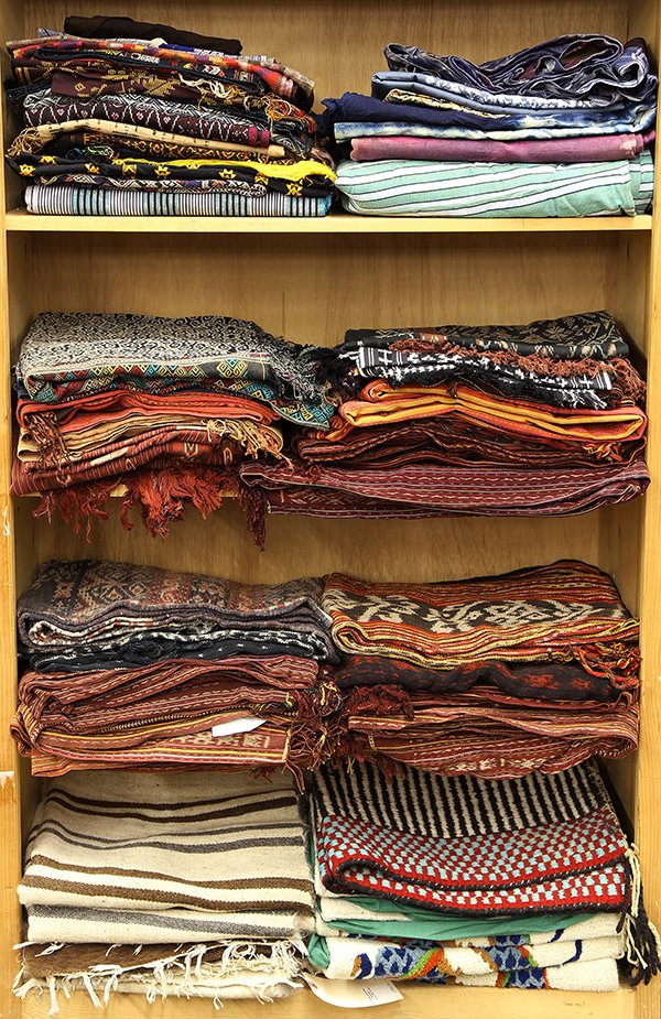 (lot of 66) Collection of Indonesian textiles, probably: (lot of 66) Collection of Indonesian textiles, probably from Java, Sumatra, Flores, Timor, etc., each having mutli-color abstract geometric patterns, in various sizes. Provenance: From the estate of E