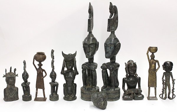(lot of 11) West African style cast metal figural: (lot of 11) West African style cast metal figural groups, most depicting seated figures having incised geometric decorations, largest: 22"h. Provenance: From the estate of Edward Gerber