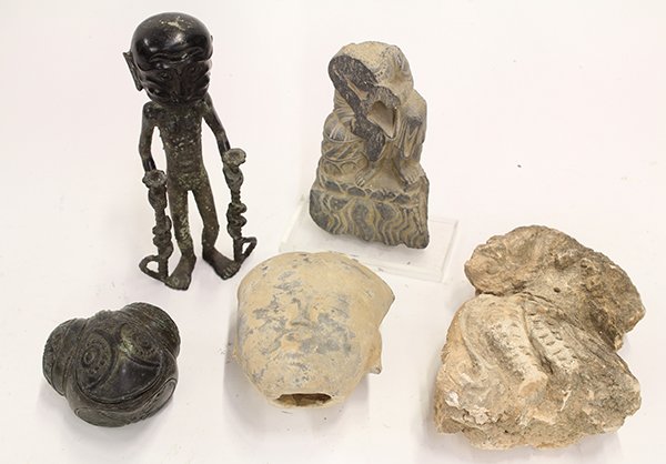 Associated group of decorative objects: (lot of 16) Asian and African decorative clay objects, mostly of seated figures, and a Han Head, all of uncertain age, largest: 9"h Provenance: From the estate of Edward Gerber
