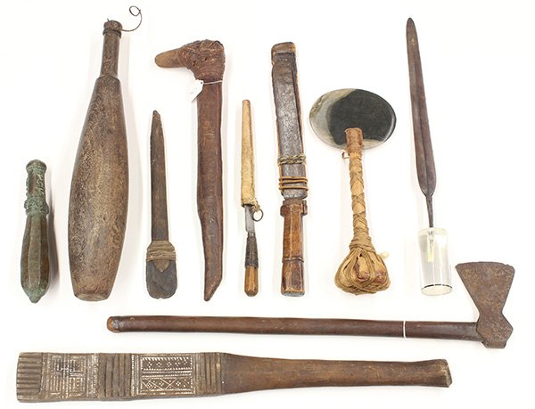 Ethnographic weapons including clubs, knives in: (lot of 10) Ethnographic weapons including clubs, knives in sheaths, axes, and hatchets, from various indegenous peoples and regions from the South Seas, some showing age and use