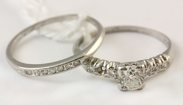 Diamond and platinum wedding ring suite: Diamond and platinum wedding ring suite the engagement ring features an old European cut diamond weighing approximately 0.42 ct., accented by five single cut diamonds (one missing) totaling approximat