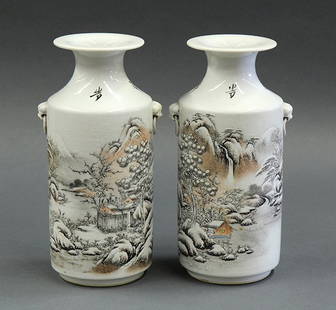 Two Chinese Vases, Snow Scene: Pair of Chinese enameled porcelain rouleau vases, the body featuring a snowy landscape flanked with two lion form handles, reversed by a colophon, cyclical date 'bingshen' and bearing signature Deng