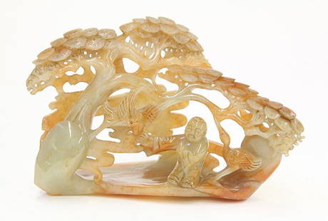 Chinese Jadeite Figural Carving, Child/Pine: Chinese jadeite carving, carved and pierced with a child and two cranes below a reticulated pine tree, the sea-green matrix with russet patches, 6.75"w
