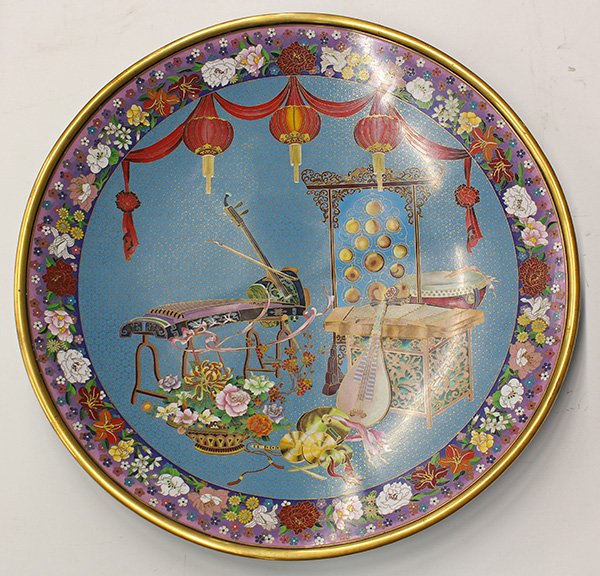 Chinese Large Cloisonne Charger, Instrument: Chinese massive cloisonne enameled charger, featuring various Chinese instruments under red lanterns on a blue ground, 25"w. Provenance: From the estate of Edward Gerber