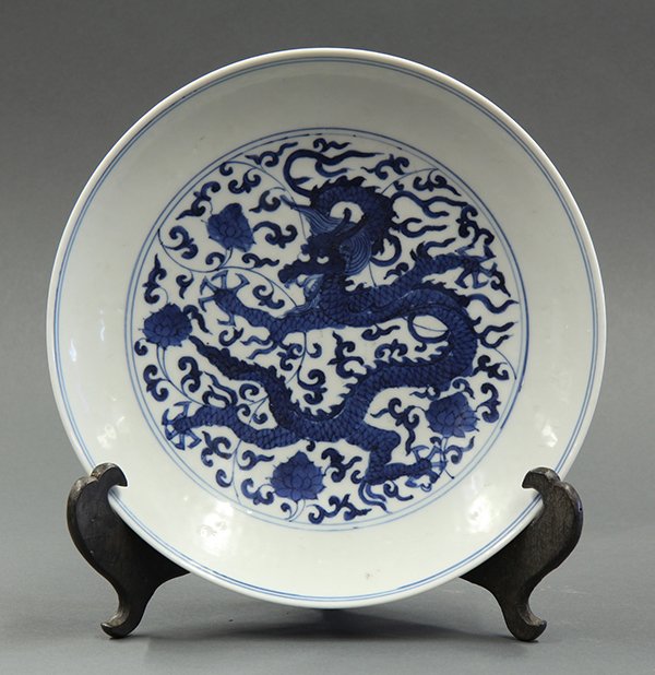 Chinese Blue and White Plate, Dragon: Chinese underglaze blue porcelain plate, with a meandering dragon amid flowering scrolls, the exterior decorated with two pairs of fu-lions, apocryphal 'Jiajing' mark to base, 8.75"w