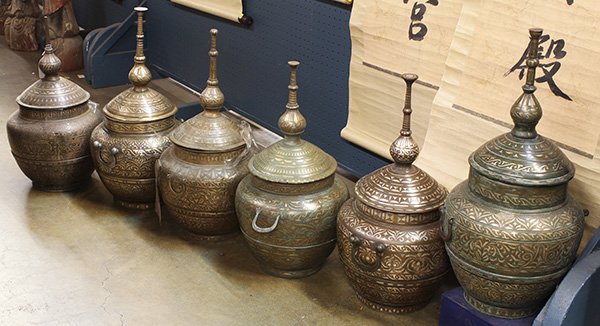 Six Filippino Silver/Bronze Containers: (lot of 6) Filippino silver inlaid bronze ritual containers, each with a globular body with a tall finial to the domed lid, 24"h. Provenance: From the estate of Edward Gerber