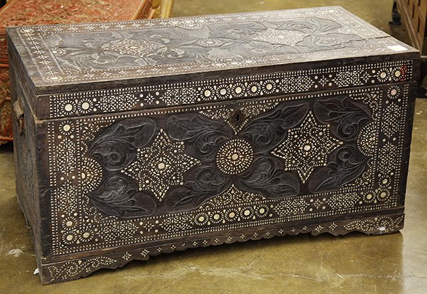 Indian Mother-of-Pearl Inlaid Trunk: East Indian mother-of-pearl inlaid wood trunk, the exterior with schematic florals accented by foliage, accented by geometric bands, 35"w. Provenance: From the estate of Edward Gerber