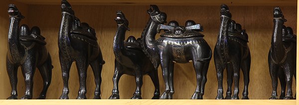 Chinese Lac Burgaute Camels: (lot of 6) One shelf of Chinese lac burgaute camels, five big and one small lacquer camels inlaid with mother pearl, 10"h; Provenance: From the estate of Edward Gerber