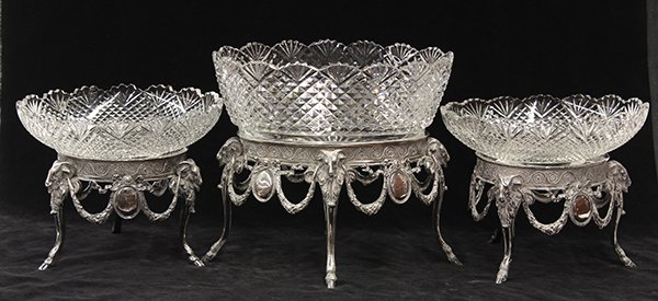 (lot of 3) Continental Neoclassical style crystal and: (lot of 3) Continental Neoclassical style crystal and silverplate centerpiece group, the largest of oval form, with a removable geometric decorated bowl, surmounting the relief decorated base accented