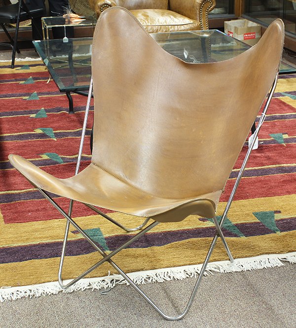 Jorge Ferrari-Hardoy 'Butterfly' chair attributed to: Jorge Ferrari-Hardoy 'Butterfly' chair attributed to Knoll, having a tobacco slung leather seat on a stainless steel bent metal frame, 36.5"h x 32"w x 30"d