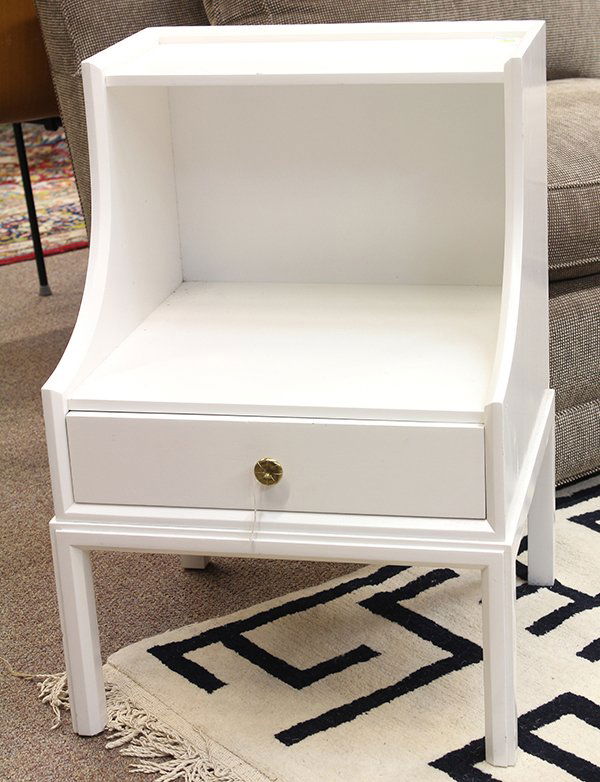 Tommi Parzinger for Charak Modern night stand: Tommi Parzinger for Charak Modern night stand, circa 1950, having a high gloss white finish over wood, with two shelves and one drawer with a brass pull, the whole rising on square legs; 26.75"h x 19.
