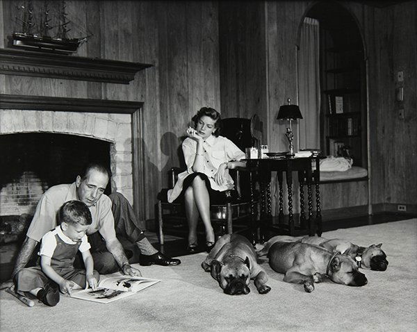Photograph, Sid Avery, Bogart, Becall, and Stephen in: Sid Avery (American, 1918-2002), Bogart, Becall, and Stephen in their Living Room, 1952, gelatin silver print, pencil signed and dated verso and on mat, stamped verso, image: 10"h x 13"w, overall: 20"