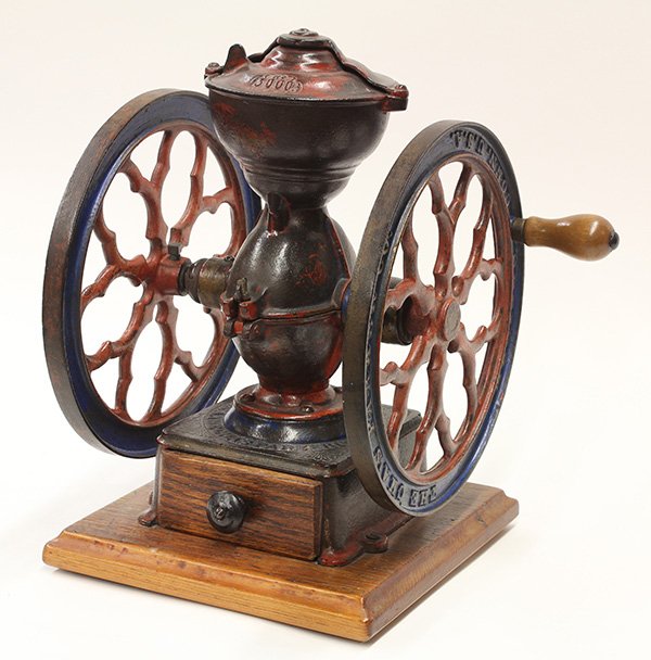 Cast iron Charles Parker model 3000 coffee grinder: Cast iron Charles Parker model 3000 coffee grinder, retains remnants of original paint, and rising on an oak base, 14.5"h