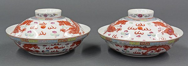 Chinese Porcelain Bowls, Dragons, Guangxu Mark: Pair of Chinese enameled porcelain bowls, late Qing/early Republic period, the shallow bowls painted with a pair of red writhing dragons in pursuit of a flaming jewel, below a key-fret band to the rim