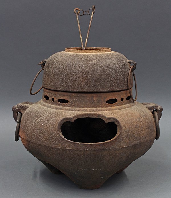 Japanese Iron Tea Kettle and Brazier: Japanese iron chagama (tea kettle) and furo (portable brazier) for tea ceremony with a pair of hibashi (iron chopstick-pokers), flattened bulbous body on short tripod, overall: 12"h x 14"dia at the wi