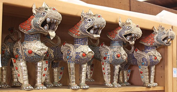 Southeast Asian Inlaid Filigree Lions: (lot of 4) Southeast Asian silvered filigree lions, each heightened in glass inlay of coral, turquoise and white hue, 12.25"w; Provenance: From the estate of Edward Gerber