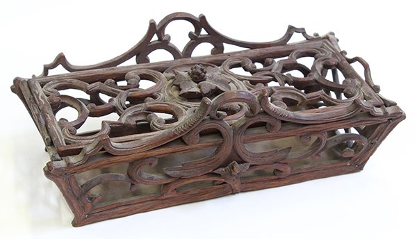 Black Forest pierce carved box: Black Forest pierce carved box, the lid centering leaves and acorns among foliate scrolls carved of twig form, having conforming sides and a solid bottom, 3.5"h x 10"l x 4.5"d