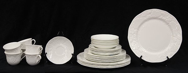 (lot of 30) Wedgwood table service for six in the: (lot of 30) Wedgwood table service for six in the Strawberry and Vine pattern, having a bas relief floral scalloped rim in blanc de chine, with six each of dinner plates, 10"dia; luncheon plates, brea