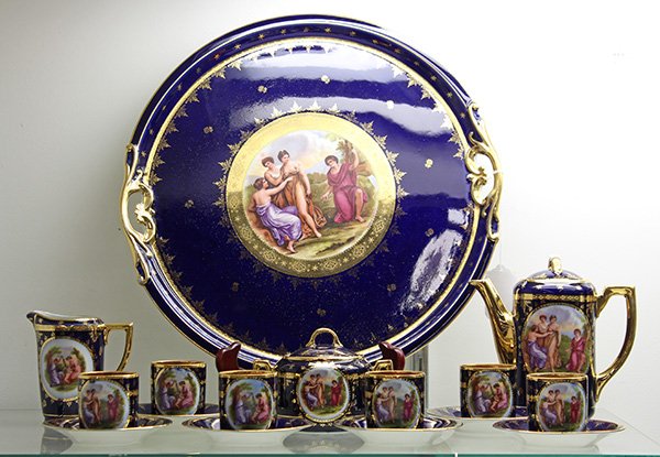 (lot of 16) Porcelain tea service by Karlsbad,: (lot of 16) Porcelain tea service by Karlsbad, Czechoslovakia, having transfer printed reserves depicting a Classical scene centered on a cobalt field with gilt accents, comprising a tray with pierced