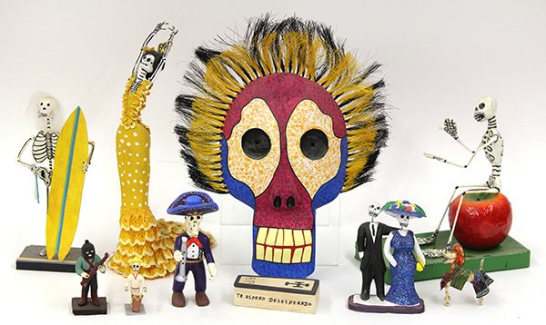 (lot of approximately 65) Day of the Dead figures,: (lot of approximately 65) Day of the Dead figures, executed in clay, carved wood, and paper mache, including mariachis, dogs, couples, and festival goers, tallest; 12"h