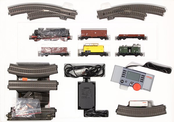 Marklin HO Digital starter train set in box: Marklin HO Digital starter train set in box, having tracks, locomotive, cars, and digital control equipment