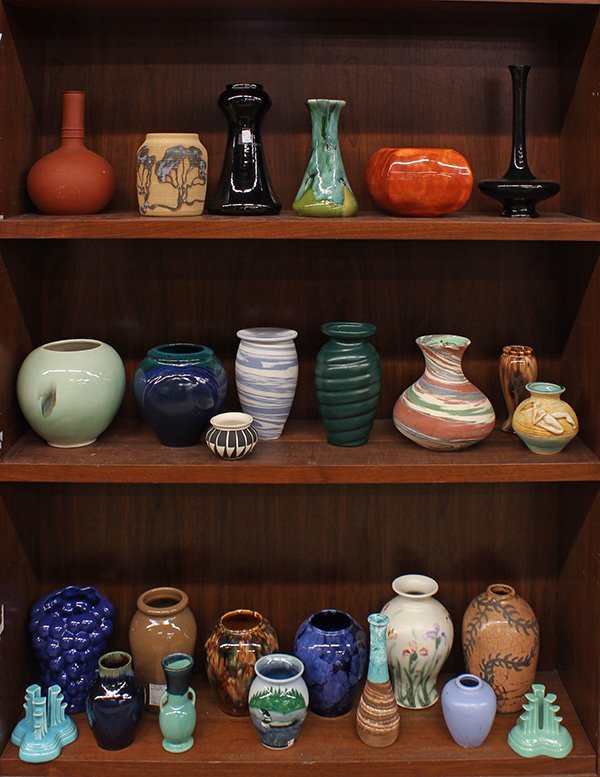 (lot of approximately 25) Three shelves of art pottery: (lot of approximately 25) Three shelves of art pottery shoulder and bulbous form vases executed in assorted glazes by Pacific, Red Wing, and studio pieces