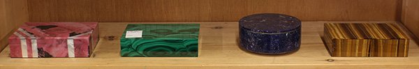 (lot of 4) Group of decorative boxes inlaid with: (lot of 4) Group of decorative boxes inlaid with semi-precious stone, consisting of a rectangular box covered in pink marble, a rectangular box covered in malachite, a rectangular box dovered in cat's