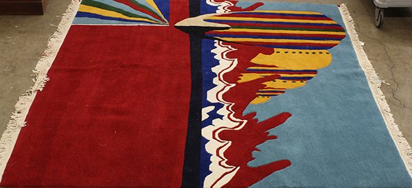 Nepalese wool carpet having a modernist design,: Nepalese wool carpet having a modernist design, executed in red, blue and yellow, 6'3" x 6'1"; Provenance: From the estate of Edward Gerber
