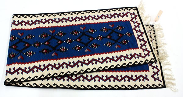 Turkish kilim runner, having repeating medallions on a: Turkish kilim runner, having repeating medallions on a teal ground, 9'5"l x 2'5"w; Provenance: From the estate of Edward Gerber