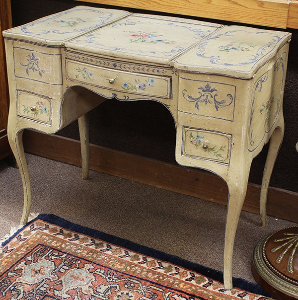 Continental polychrome decorated vanity: Continental polychrome decorated vanity, 18th/19th century, the three part top centered with paint decorated floral reserves, the center of which opens to reveal a mirror, and is flanked by compartmen