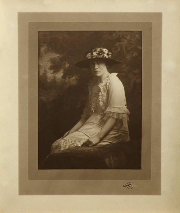 Photographs, Edward Sheriff Curtis and American School: (lot of 2) Photographs, Edward Sheriff Curtis (American, 1868-1952), Woman in a Flower Brimmed Hat, photogravature, signed lower right, Curtis Studio, Seattle Washington stamp verso and American Schoo