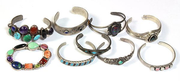 Collection of gem and silver jewelry: Collection of gem and silver jewelry including eight cuff bangle bracelets set with various gems including turquoise, malachite, lapis, amethyst, citrine, shell, etc., together with a sterling silver