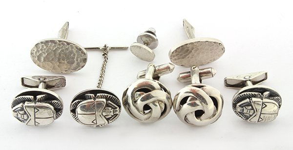 Collection of gentleman's sterling silver jewelry: Collection of gentleman's sterling silver jewelry including a pair of Allan Adler sterling silver scarab motif cufflinks and matching tie tac, signed Allan Adler; A pair of mid century Harold Fithina