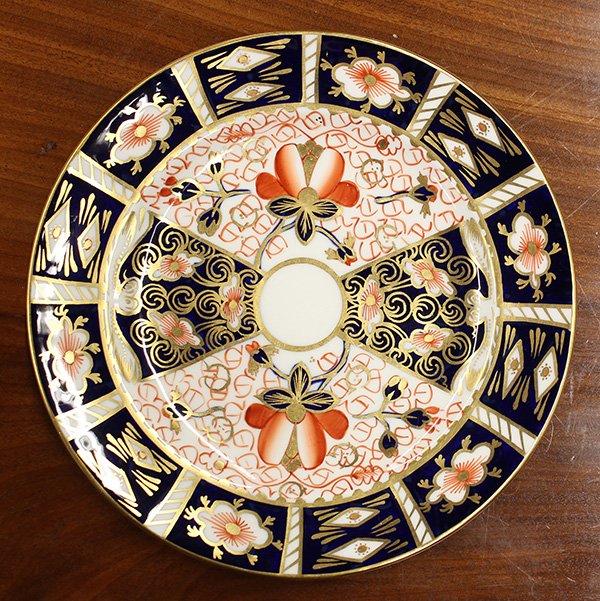 (lot of 21) Royal Crown Derby 'Old Imari' dessert: (lot of 21) Royal Crown Derby 'Old Imari' dessert service, decorated in cobalt, orange, and gilt hand painted designs, comprising (11) dessert plates, 8"dia and (10) tea cups and saucers
