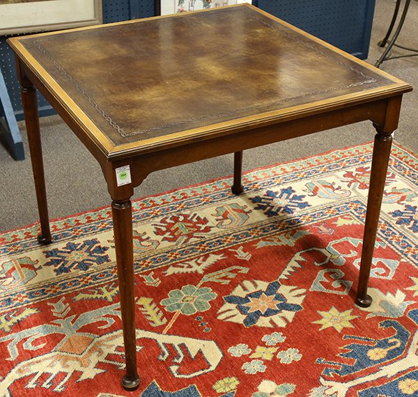Georgian style games table: Georgian style games table, having a square top with a tooled leather playing surface and rising on turned, tapered legs terminating on pad feet, 28"h x 31.5"sq