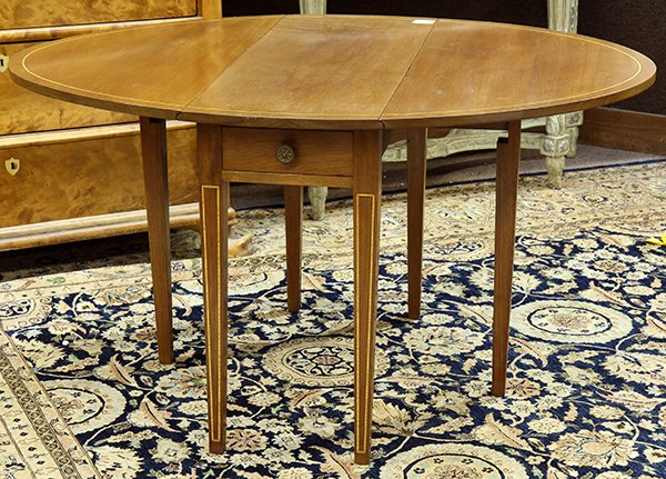 Hepplewhite style pembroke table: Hepplewhite style pembroke table, having an oval top with contrasting band inlay above two drawers with brass pulls, the whole rising on square tapered legs accented with conforming inlay; 27"h x 49.5