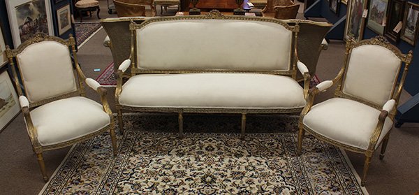 Louis XV style giltwood carved salon suite: (lot of 3) Louis XV style giltwood carved salon suite, each having a relief carved frame with rosette medallions above the fluted stiles surmounting the scrolled returns continuing to the upholstered 