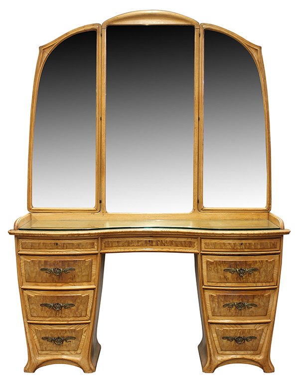 French Art Nouveau dressing table vanity: French Art Nouveau dressing table vanity, circa 1900, the three panel mirrored superstructure, having a stylized carved crest, above the glass kidney shaped top surmounting nine drawers, six with high