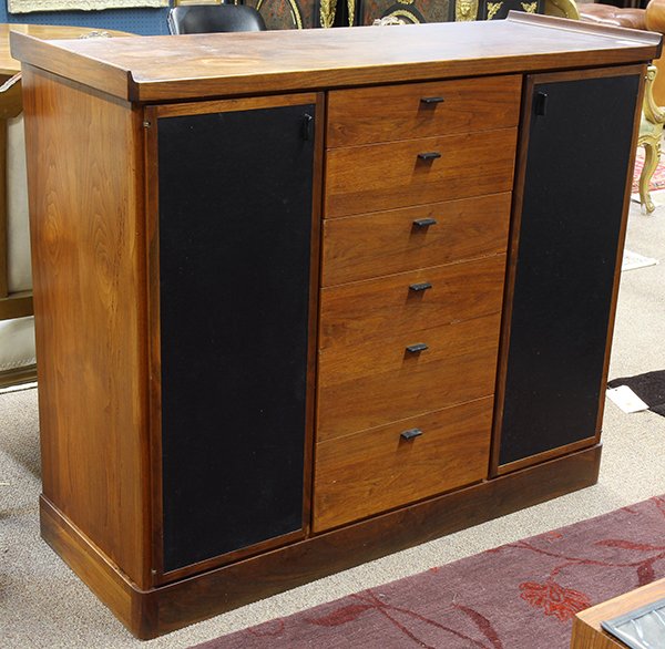 Danish Mid Century Modern style gentelmen's valet: Danish Mid Century Modern style gentelmen's valet, executed in teak, the rectangular top surmounting six drawers flanked by two doors with ebonized wood panels, each opening to a fixed shelf interior,