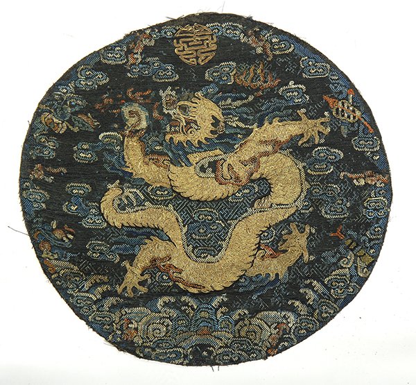 Chinese Dragon Roundel: Chinese embroidered dragon roundel, with a five-claw gilt couched dragon clutching a jewel, on a ground woven with clouds and Daoist treasures above rolling waves, 11.4"w