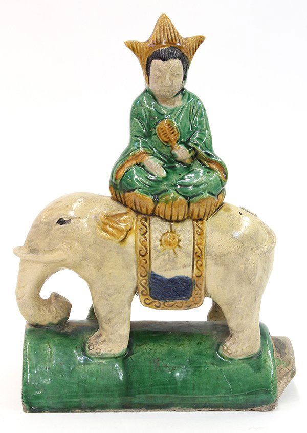 Chinese Ceramic Roof Tile: Chinese glazed ceramic roof tile, of a female deity holding a fan and seated above an elephant, 12"h