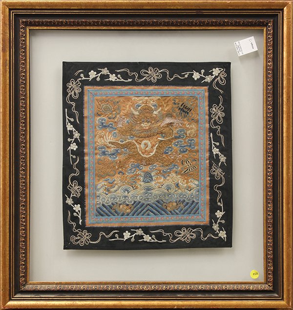 Chinese Textile, Dragon: Chinese embroidered panel, with a gilt dragon amid the clouds, heightened by Buddhist treasures above the sea on an orange ground, overall (frame): 26.5"h × 26.5"w