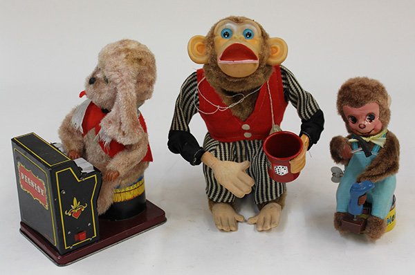 (lot of 3) Japanese mechanical toys: (lot of 3) Japanese mechanical toys, circa 1950, consisting of a 'Little Monkey Shoe Maker' wind-up having a hammer and a boot, 6.5"h; a battery operated 'Dice Shooting Monkey' by Cragstan, 9"h; and a