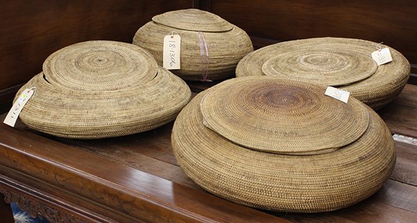 Indonesian coiled storage baskets: (lot of 4) Indonesian coiled storage baskets, possibly from central Lombok, each having a lid, and a round, squat form, largest: 31"dia.: Provenance: Property sold to benefit the Phoebe A. Hearst Muse